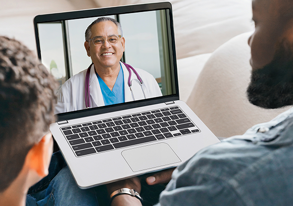 A father and his son speaking with an On Demand Care specialist